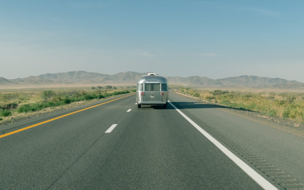airstream travel trailer on the road