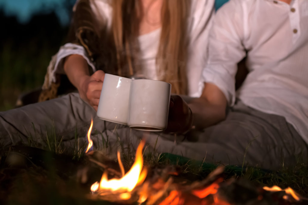 Cozy Couple of Mugs at Campfire